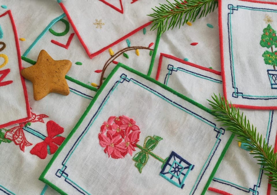 Close-up of a machine-embroidered rose topiary on a linen cocktail napkin